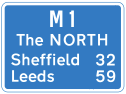 Motorway signpost showing only 32 miles to paradise